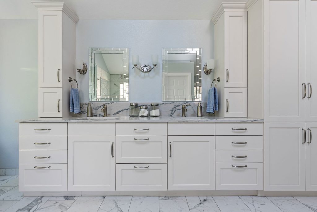 white bathroom cabinets with mirror and unique tiles
